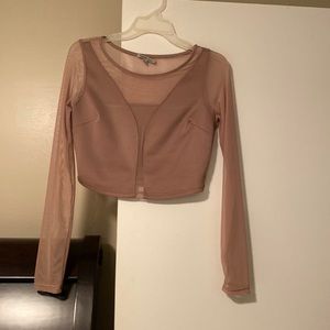 Nude colored sheer long sleeved crop top
